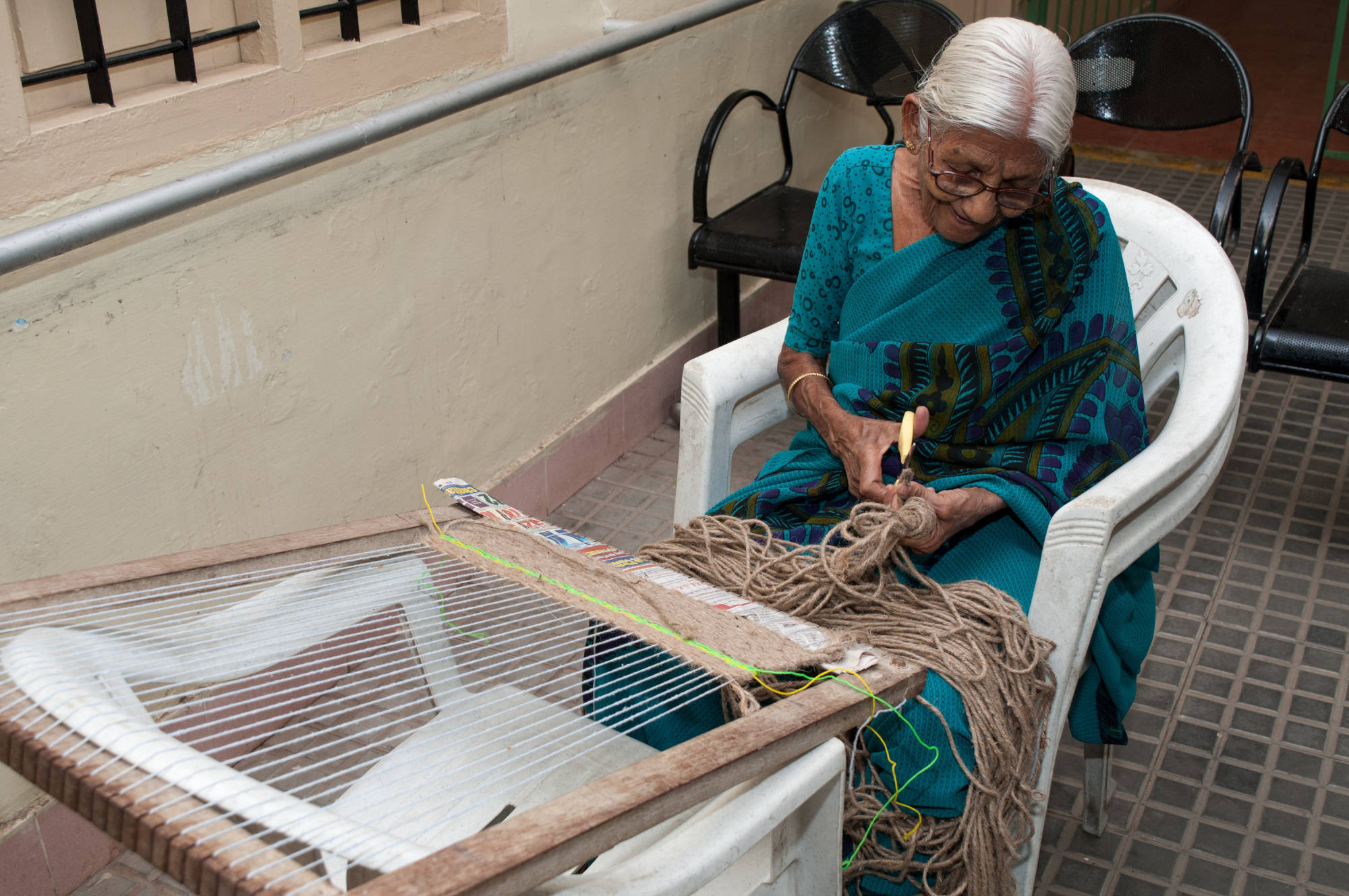 Hand made door mat being made by our elder at SK